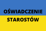 Na niebiesko-żółtej fladze Ukrainy czarny napis &quot;oświadczenie starostów&quot;. 